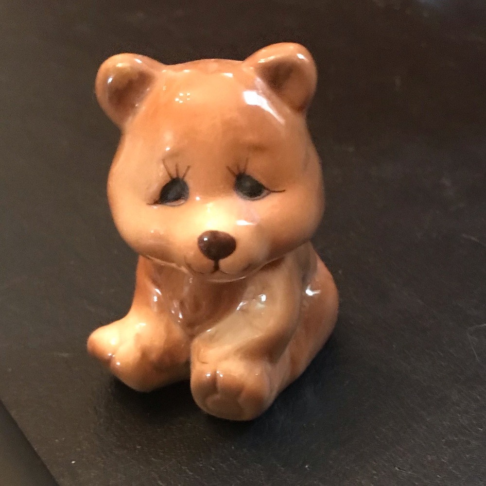 Approximately 2”x2” china figurine. No markings.